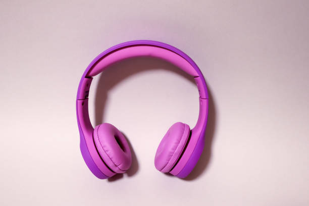 22 year old happy Asian woman listening to music with wireless headphones