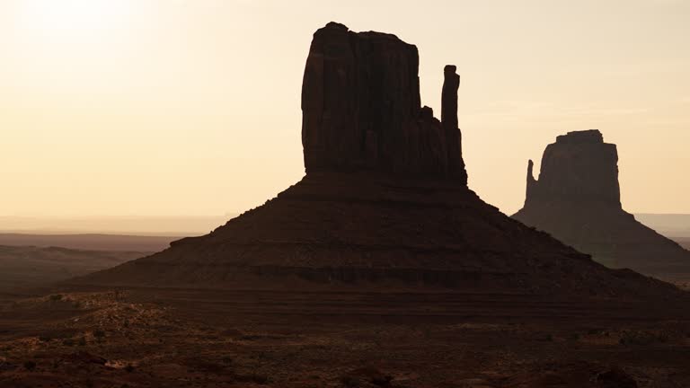 Monument Valley West and East Mitten Butte Sunrise Time Lapse Pan L Arizona Southwest USA