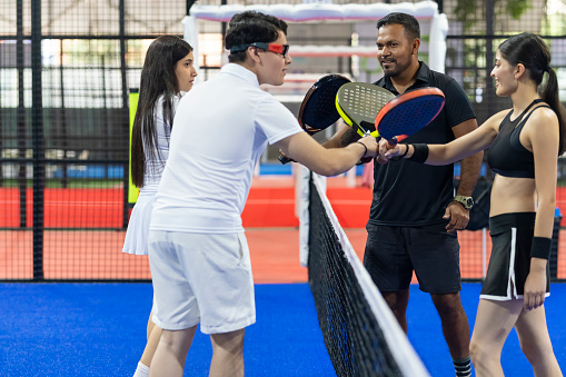 Padel opponents greeting each other