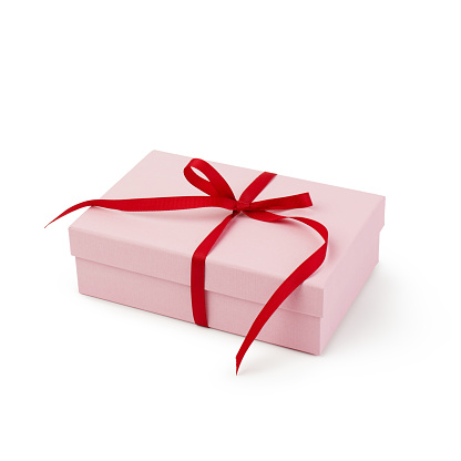 Pink gift box with ribbon on white background