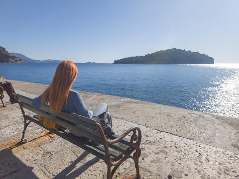 Tourist enjoy nice sunny day on Adriatic sea near old city of Dubrovnik