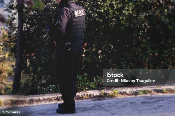 Hellenic Police With Greek Police Logo Emblem On Uniform Greek Police Squad On Duty Maintain Public Order In The Streets Of Athens Attica Greece Group Of Policemen Stock Photo - Download Image Now
