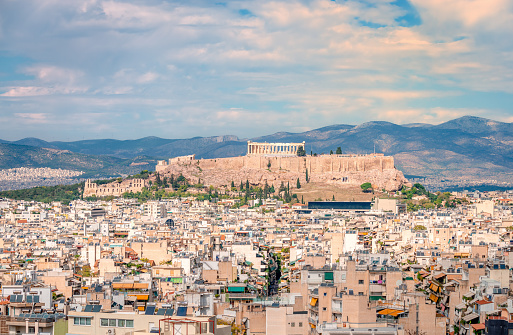 The Athens skyline, seen from Kynosargous Hill. The Acropolis Hill with the Parthenon and the Odeon of Herodes Atticus dominates the picture.