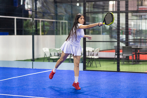 Young person playing paddle tennis