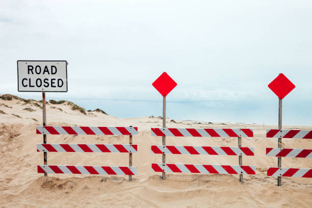 Empty banner on sandy beach near marram grass dune, on Sylt island, at North Sea, Germany, on a sunny day of summer. Summer beach context. Beach sign.