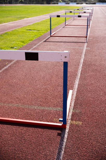 istock barriers at running track in stadium 1976070683