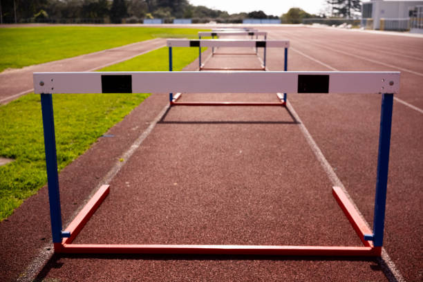 istock barriers align on Race track field 1976071198