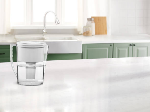 istock Water pitcher in a kitchen on a marble counter top 1976081572