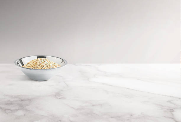 istock Bowl of oats on a marble counter top 1976082102