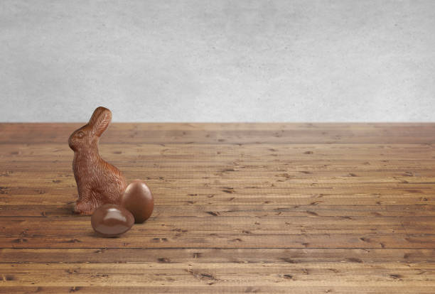 istock Chocolate Easter bunny and chocolate eggs on a wood counter top 1976082109