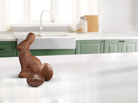Chocolate Easter bunny and chocolate eggs on a counter top