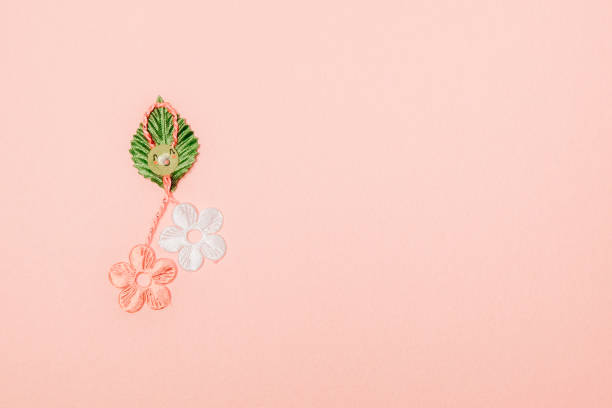 istock One beautiful floral martisor on a pink background. 1976131142