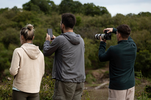 Everyone takes the opportunity to take photos on safari