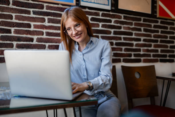 istock Redhead female student in a coffee shop 1976157700