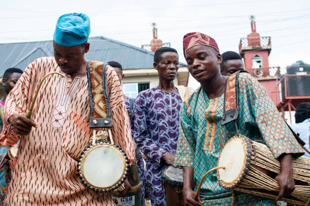 Group of traditional performers in Ibadan 4 April 2017, Ibadan Nigeria: Image captured during Nigerian Photography Classroom group at a photowalk in aimed at vising the Olu Ibadan of Ibadan land in Nigeria. oyo state stock pictures, royalty-free photos & images