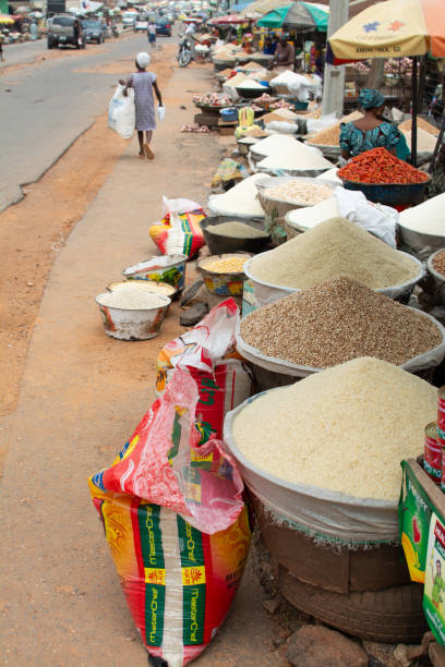 Road side food market in Ibadan 4 April 2017, Ibadan Nigeria: Image captured during Nigerian Photography Classroom group at a photowalk in aimed at vising the Olu Ibadan of Ibadan land in Nigeria. oyo state stock pictures, royalty-free photos & images
