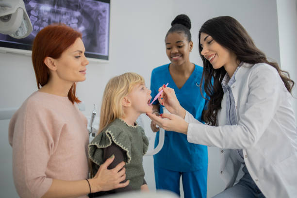 istock Little girl visiting a dentist 1976185205
