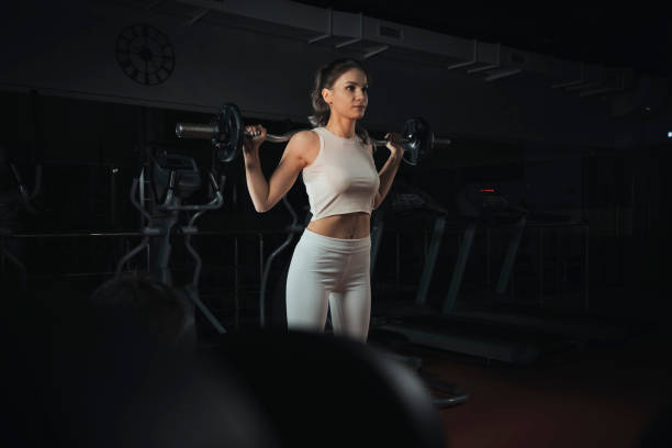 istock woman training with heavy barbell in modern gym 1976188855