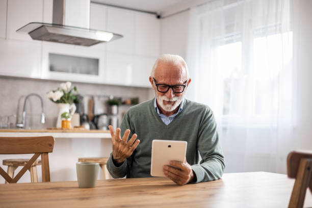 istock A mature man has a video call at home. Footage of an elderly man using a digital tablet for a video call with his loved ones 1976189383