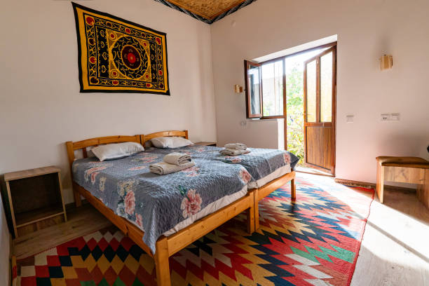 Double bed with bedside tables in hotel room