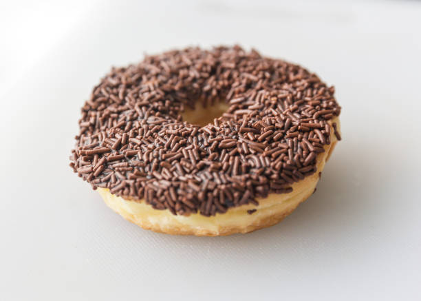Close-up shot of Chocolate Sprinkle Donut from top view in white background