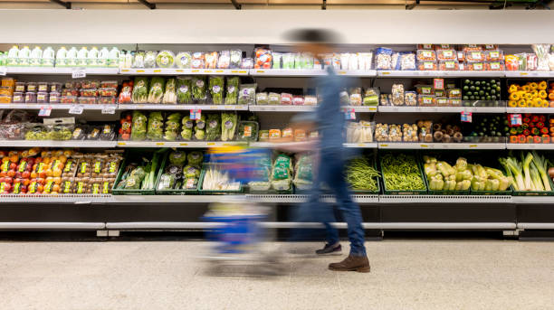 Man shopping at the supermarket - blurred motion