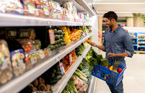 istock Man buying vegetables at the supermarket 1976222130