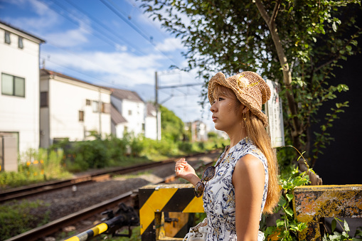 Woman visiting town in summer