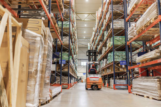 istock Transporting goods in a logistic center's warehouse with a forklift. 1976227819