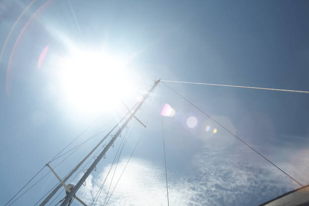 Sun burst looking up at sail mast