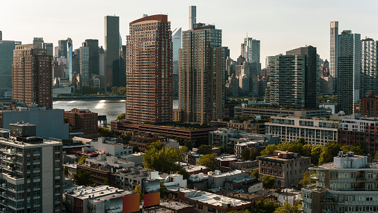 Modern Condos in Long Island City, Queens and Hunters Point along the East River, with the view of Midtown Manhattan.