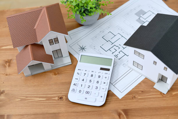 istock Architectural models of houses, house plans, calculators 1976331046