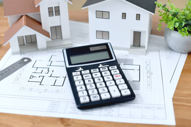 istock Architectural models of houses, house plans, calculators 1976331059