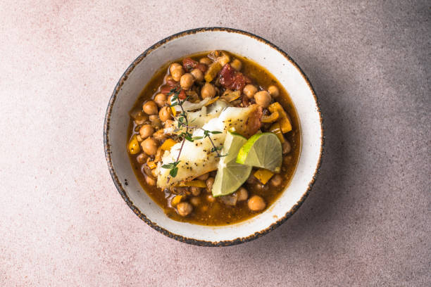 istock Potaje de vigilia - Chickpea stew with spinach and cod. Typical spanish food for Easter holidays. Chickpea stew with spinach 1976368612