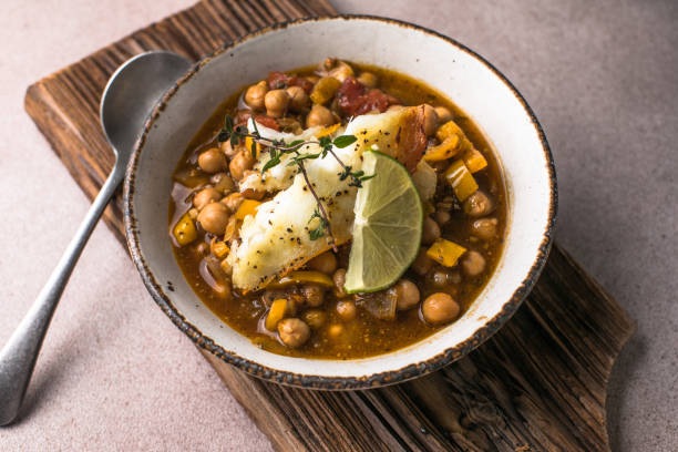 istock Potaje de vigilia - Chickpea stew with spinach and cod. Typical spanish food for Easter holidays. Chickpea stew with spinach 1976368614