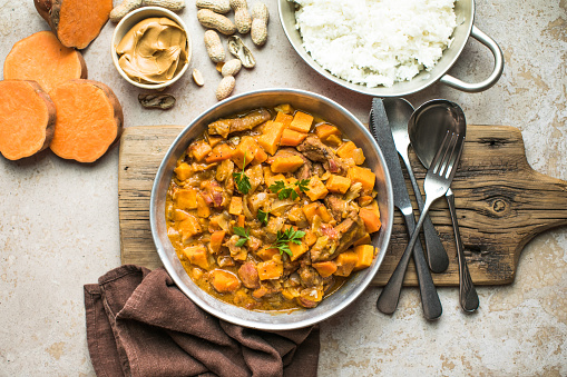 African chicken peanut stew with sweet potatoes  with side of basmati rice