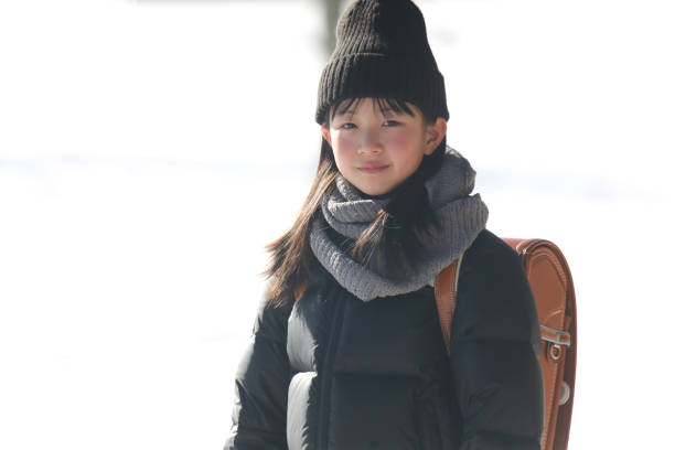 girl carrying a school bag