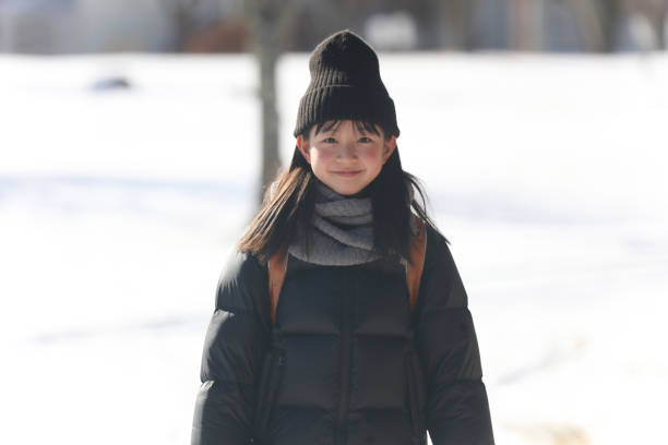 istock Smiling girl carrying a school bag 1976449300