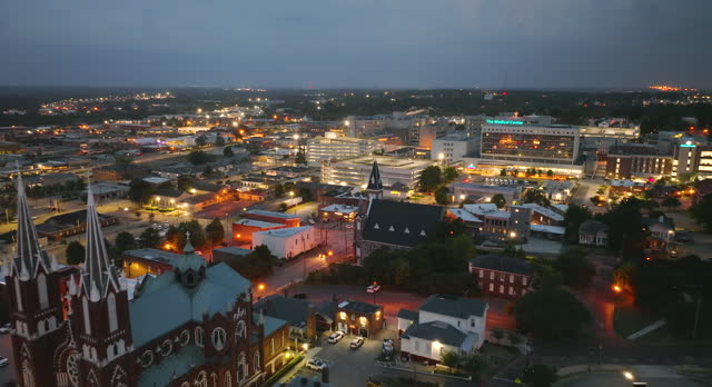 Aerial view of Macon, historic city in central Georgia with old historical architecture. USA panoramic cityscape at night