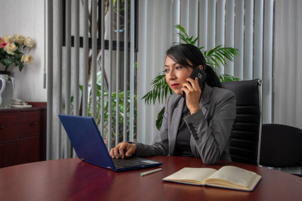 istock Latin woman's hands typing on a computer as part of her entrepreneurial and networking work 1976499958