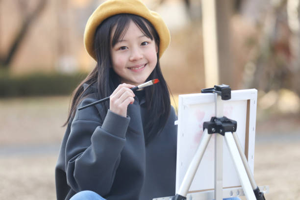 istock girl drawing a picture 1976512526