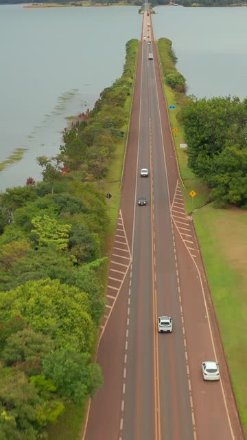 Aerial View of highway adjacent to a large body of water