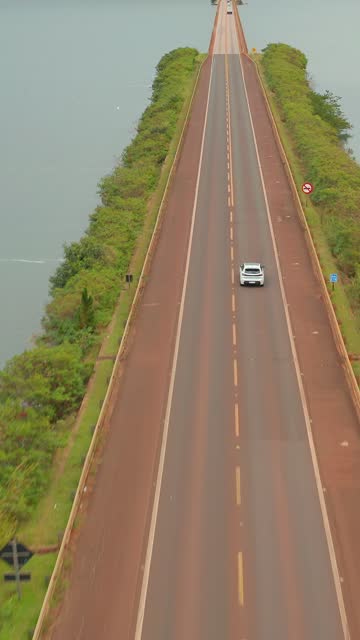 Aerial View of highway along a body of water