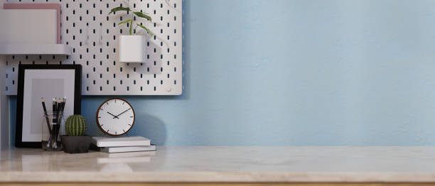 istock Home decors and a space for displaying your product on a white marble tabletop with the blue wall. 1976545411