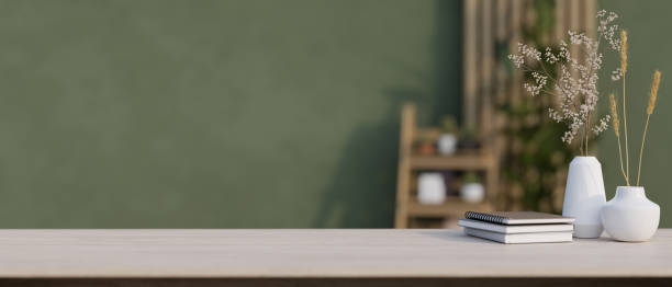 istock A space for displaying your product on a table in a modern room with the green wall. 1976549571