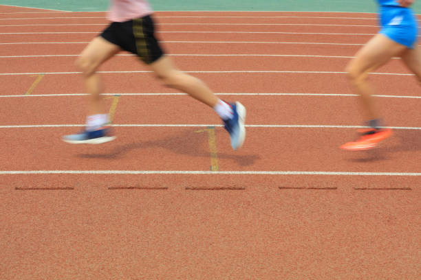 Long distance runners are running on the track
