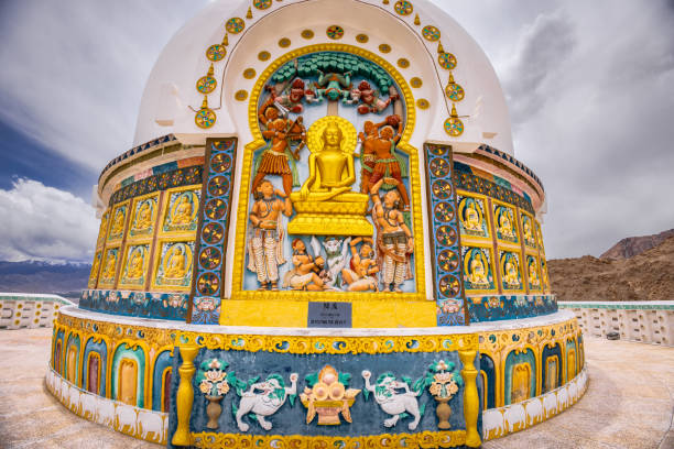 Shanti Stupa depicting Buddha defeating the Devil, Leh Ladakh, India The Shanti stupa wide shot. It is believed that relics of Buddha lie at its base. leh city stock pictures, royalty-free photos & images