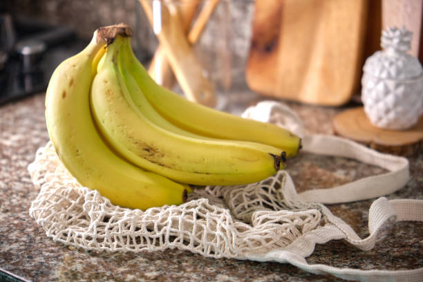 istock Recycled Eco bag with fresh delicious bananas. No plastic. Eco friendly concept. 1976573514