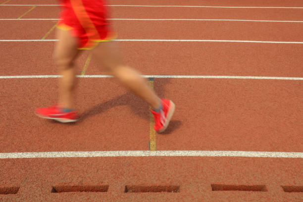 Long distance runners are running on the track