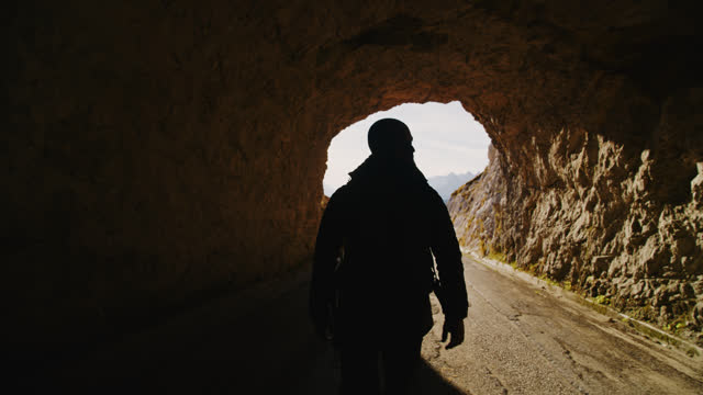 SLO MO Into the Unknown: Lone Hiker Ventures into Mountain Tunnel